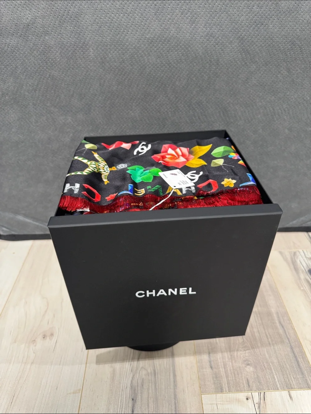 CHANEL Black Floral Logo Silk Scarf with Red Fringe
